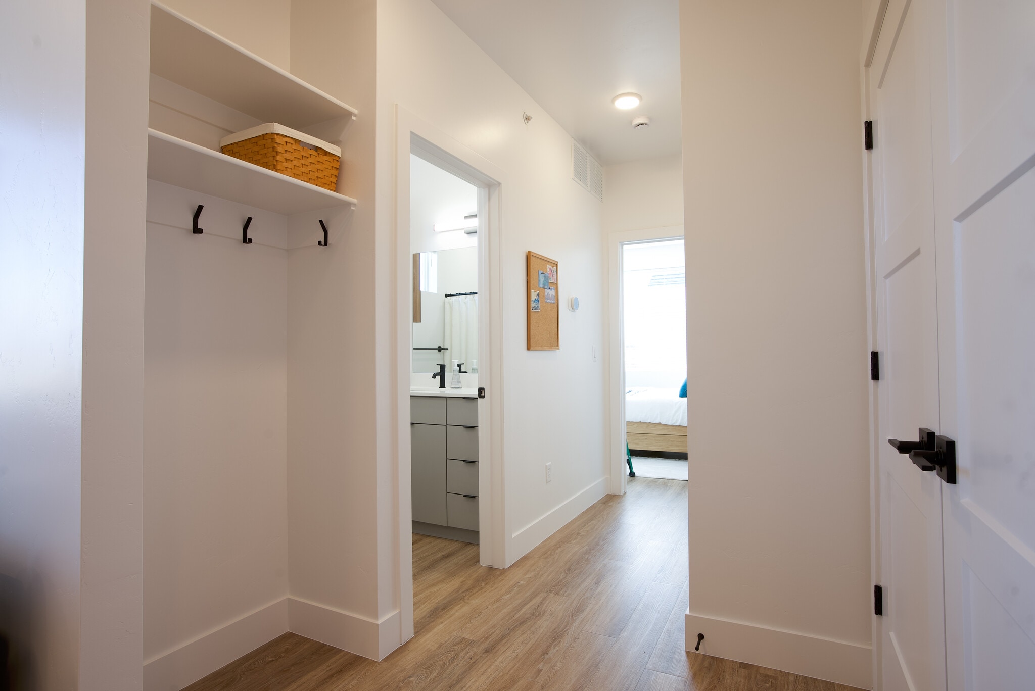 Hallway with coat hook nook, hallway bathroom - 525 N 1st St