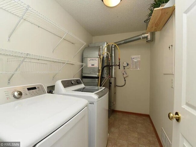 Building Photo - 3 Bedrooms | Loft | Upper-Level Laundry | 3-Sided Fireplace | Woodbury