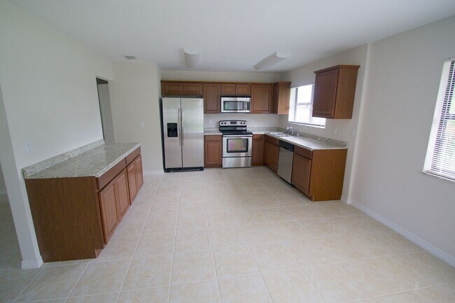 Building Photo - Waterfront 3BR Home on Canal | Spacious Yard | Lawn Care Included | Pet Friendly