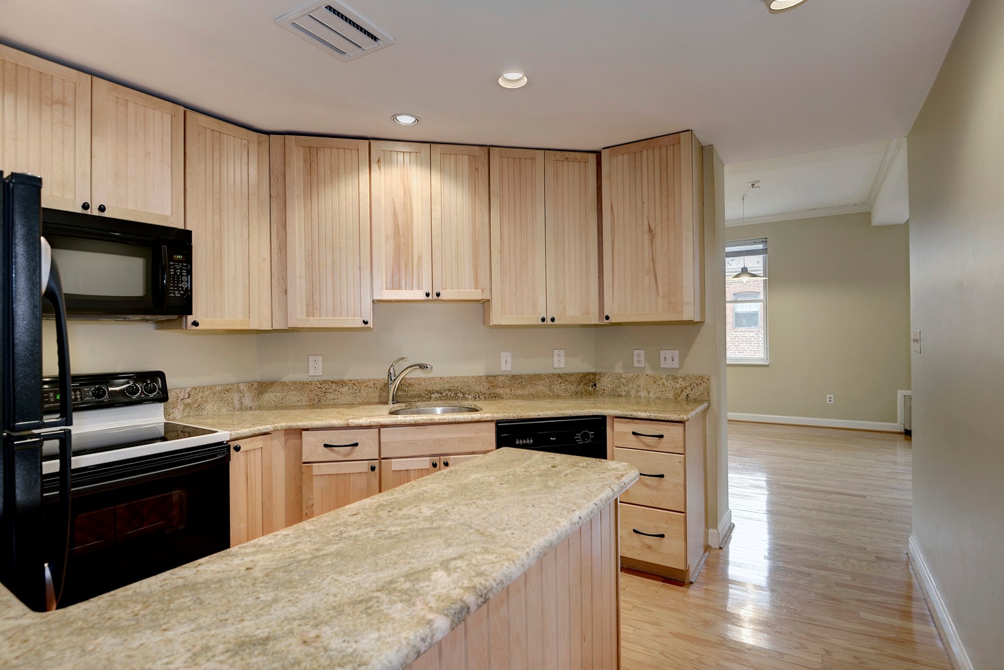 Open kitchen with granite and cabinets galore! - 1741 T Street Northwest