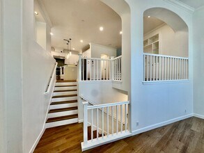 Building Photo - Beautifully Remodel Townhouse with AC & Two Car Garage!