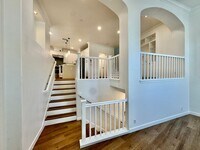 Building Photo - Beautifully Remodel Townhouse with AC & Two Car Garage!