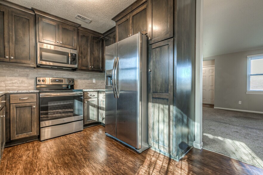 All new kitchen cabinets and appliances. Refrigerator included. - 13749 W 62nd St