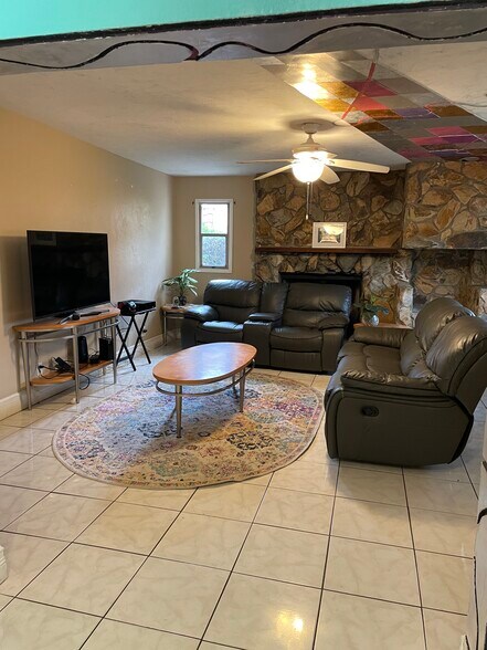 Fireplace in den room - 6449 101st Way N