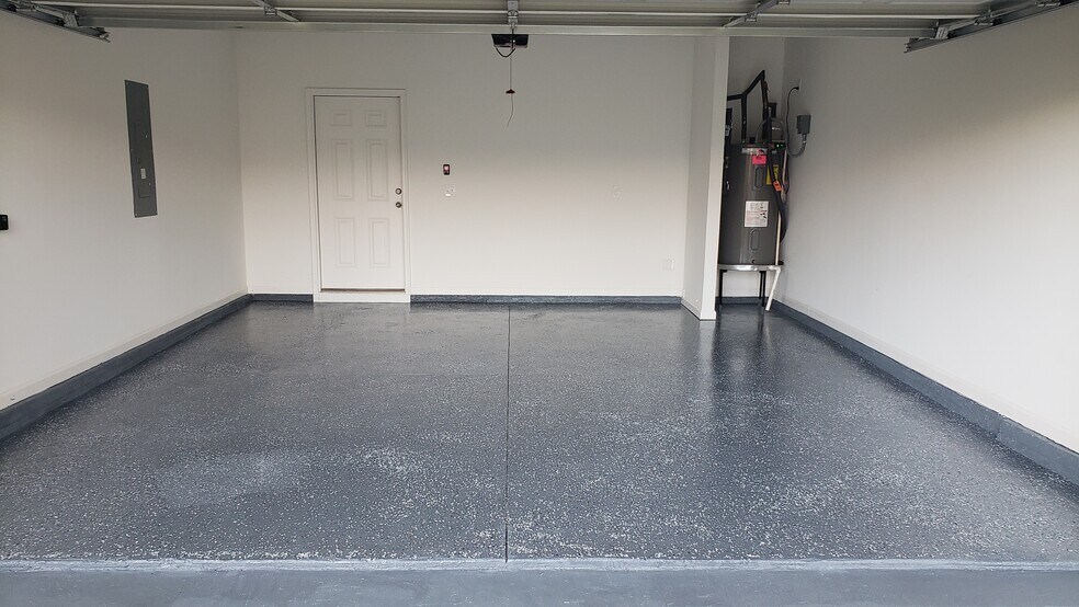 Garage with epoxy flooring - 208 Overton Dr