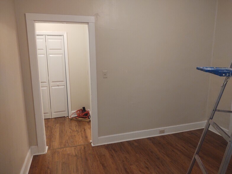 Master bedroom toward dressing area, master bath to the right - 116 Houseworth St