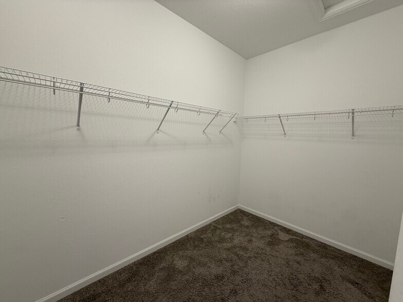 Primary walk-in closet - 26987 E Maple Ave
