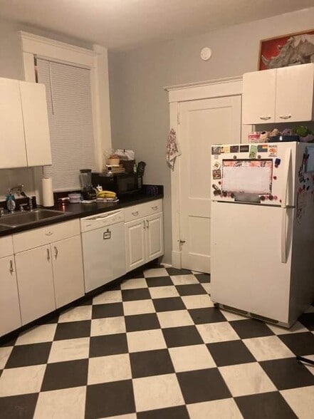 Kitchen with door to basement and side door - 729 Gallion Ave