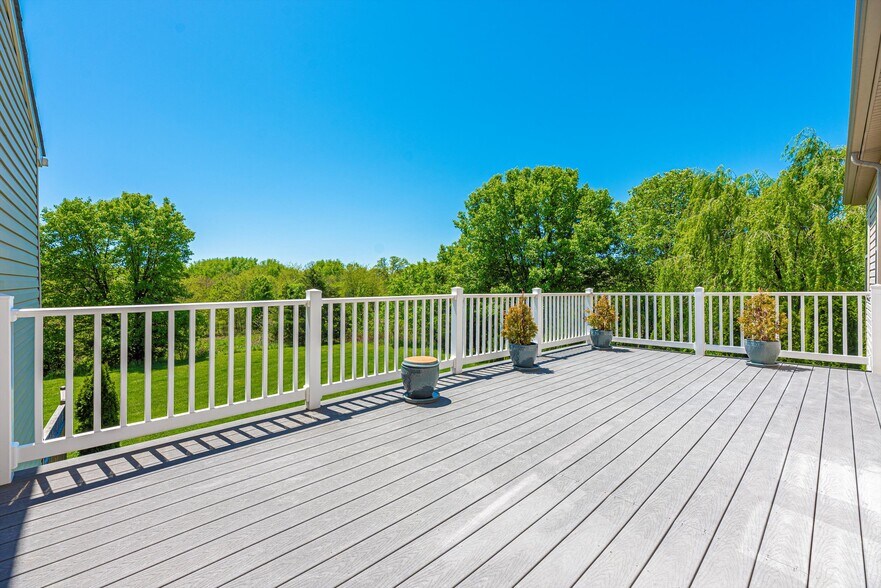 Back deck overlooking grass and trees - 2507 Mill Race Rd
