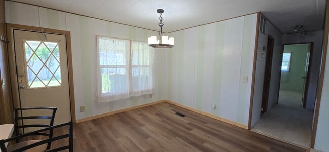 Building Photo - 2 bed 2 baths with carport