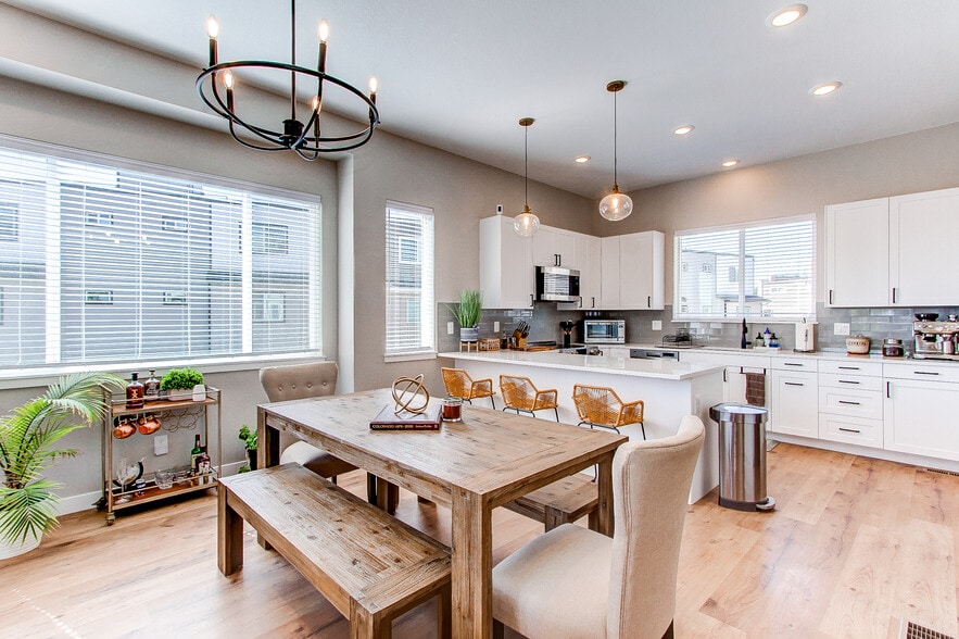 Open-concept dining room and kitchen - 8500 W 62nd Ave
