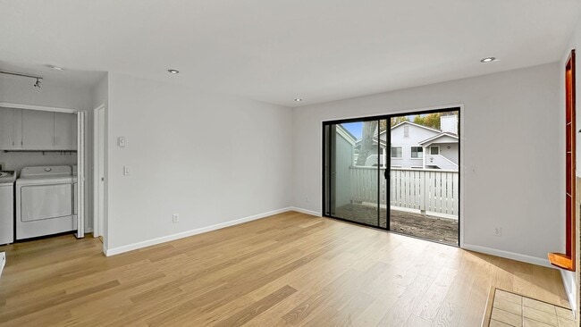 Building Photo - Waterfront Top-Floor West-Facing Apartment...
