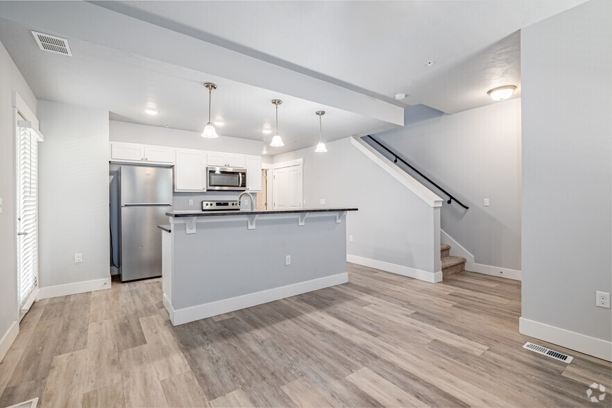 2BR, 2BA - 996SF - Kitchen / Living Room - The Village Apartments and Townhomes