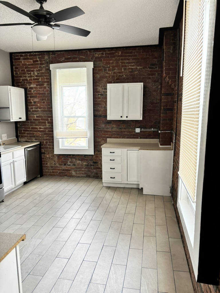 Exposed brick and roomy cabinet storage - 2621 Arsenal St