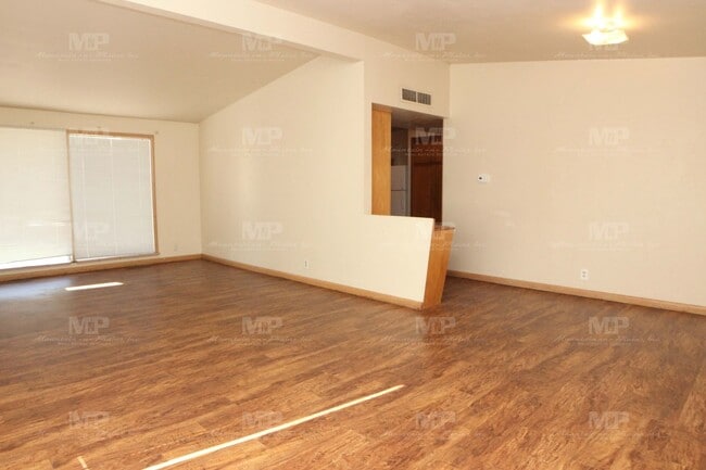 Building Photo - Three Bedroom with Covered Parking Spot!