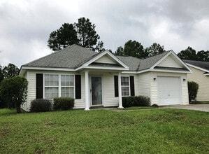 Building Photo - Pet Friendly 3 Bedroom, 2 Bath Home with Garage and Fenced In Back Yard!