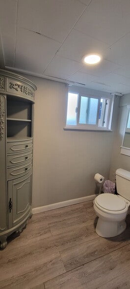 Lower level bathroom has an additional sink to the right. - 814 Atchison Ave