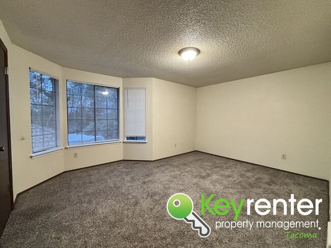 Building Photo - Comfortable Upstairs 2 Bedroom 2 Bath Rental in Private Community Near Fircrest!