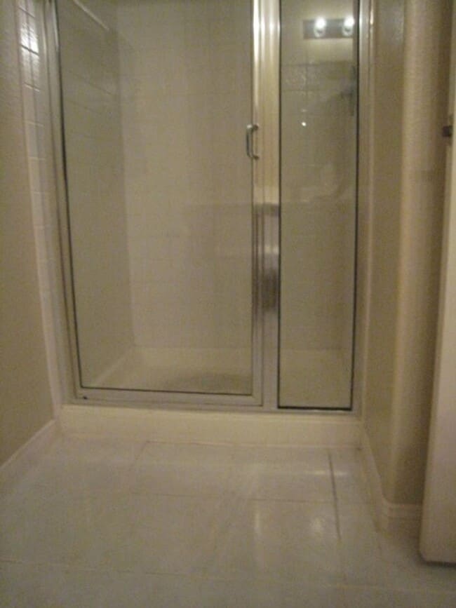 Building Photo - 2nd Story Condo in gated community close to the pool.