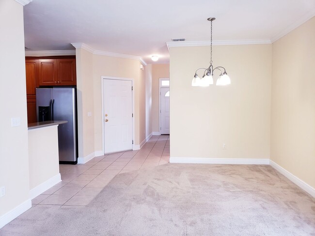 Building Photo - 3 bedroom town home for rent early January 2026, gated community with a garage for $1725 per month