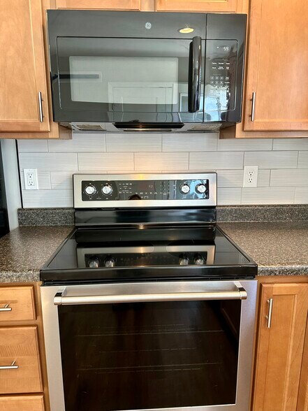 New stove with self cleaning oven - 2312-A Belle Ave NE