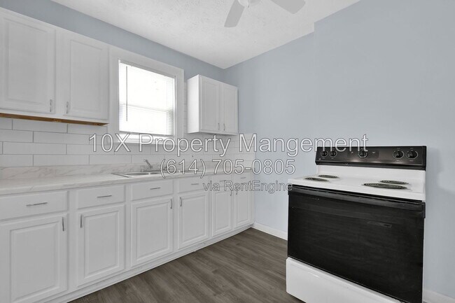 Building Photo - 1311 E 24th Ave