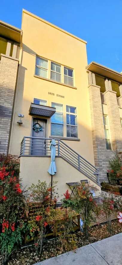 Located steps from the pool, this unit has excellent curb-appeal. A small patio adorns the entrance - 5429 Strand