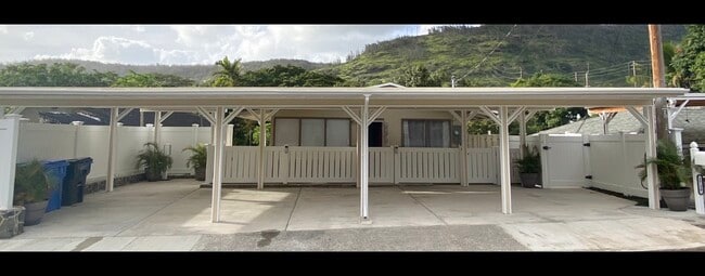 Carport with two parking spaces (each on the ends) - 1739 Kamohoalii St