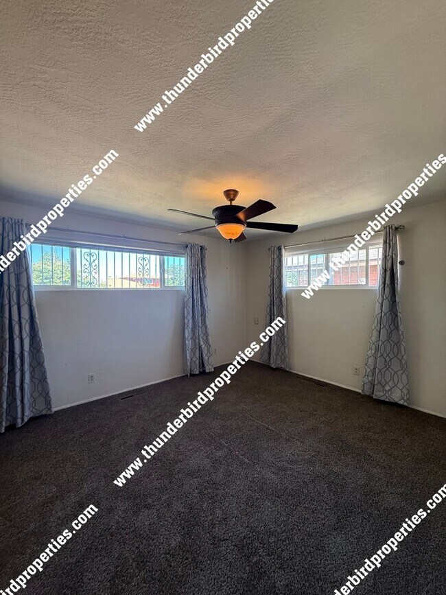 Building Photo - Desired NE location near Sandia High Schoo...