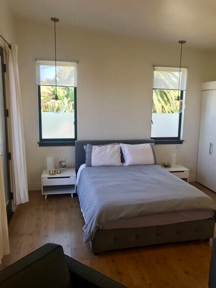 bedroom comfortably fits queen bed and side tables , with pendant lights - 1072 Amoroso Pl