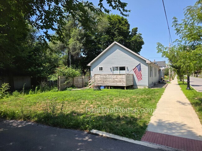 Building Photo - Available August 16! A pet friendly ranch with dishwasher, garage, basement, storage, yard, deck