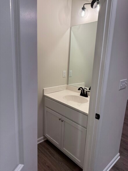 Convenient half bath located on the main floor -perfect for guests - 205 Cherry Way
