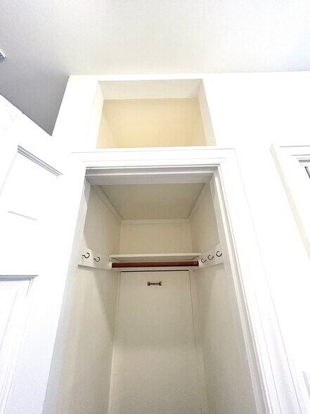 Hallway coat closet with extra storage on top - 301 M St NW