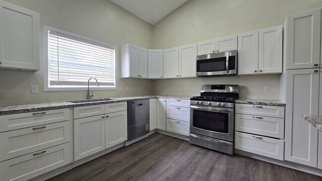 Building Photo - Spacious Ranch Style 5-Bedroom Home with Oversized 4 Car Garage / Workshop, 4 RV Carport & 1 Acre...