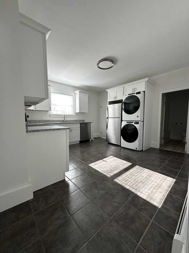 Spacious kitchen with all brand new amenities featuring in unit, washer and dryer - 12 Tiffany St