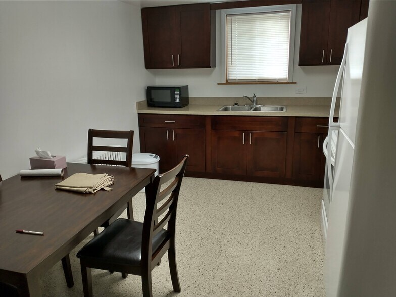 Kitchen with Moder Wood Cabinets - 5260 W Foster Ave