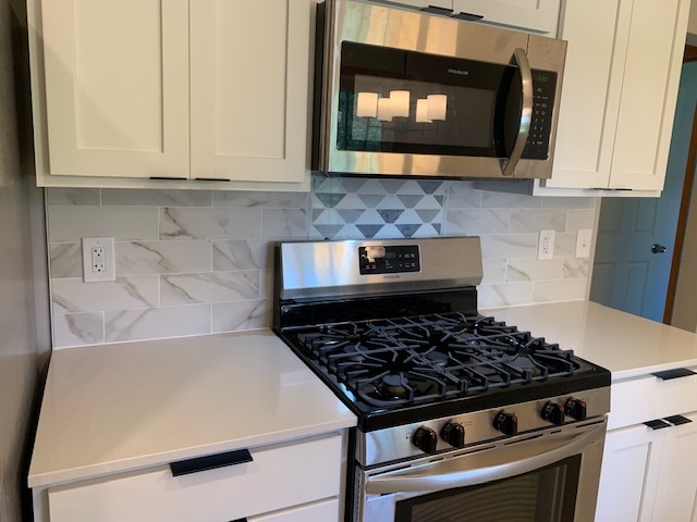 Gas range and modern tile backsplash - 5206 Grandview Ln