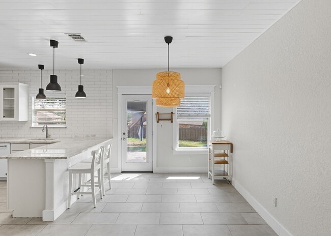 Building Photo - Discover the perfect blend of comfort and space at 6323 Myrtle.