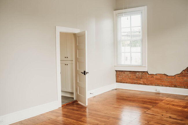 Exposed brick in Bedroom - 529 E Washington St