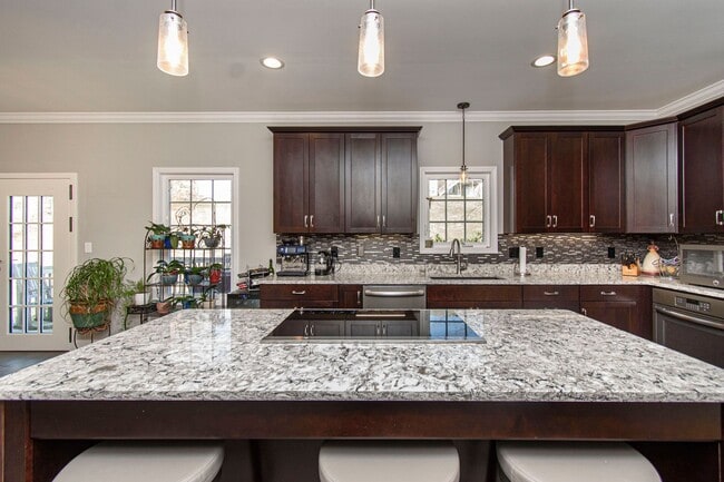 Building Photo - Spacious Home with Hot Tub, Fenced Yard an...