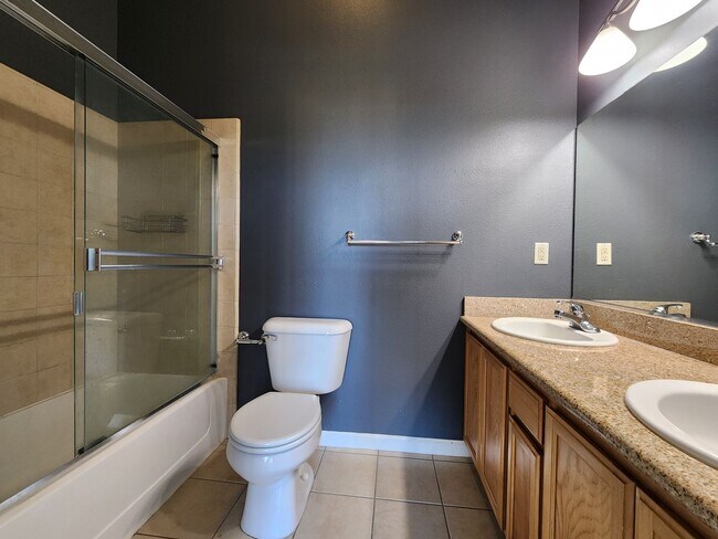 Building Photo - Modern 2BR/2.5BA Condo with Ensuite Bathro...