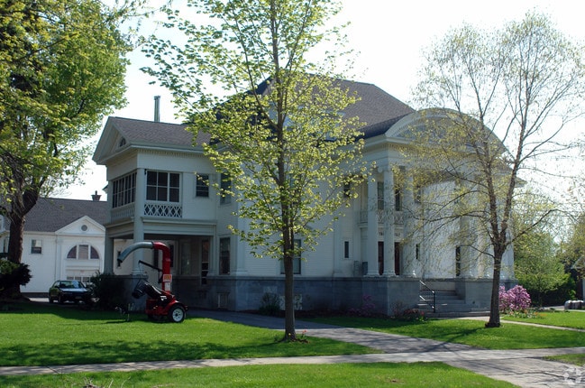 Two entrance points to back parking, quaint screend porch area for two units. - The Carlisle