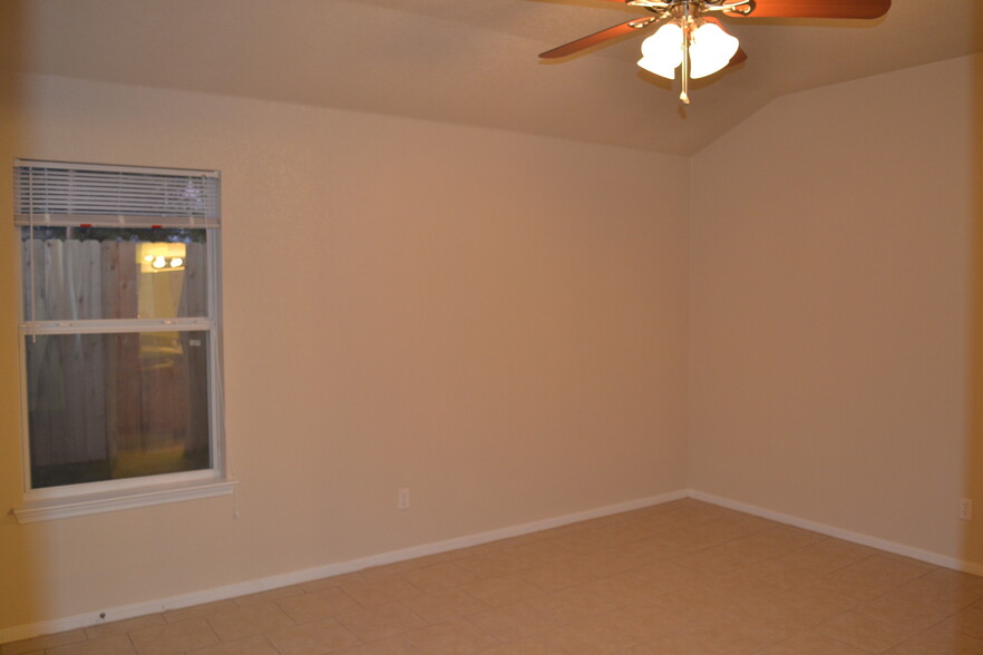 Master bedroom showing ceiling fan. - 220 Ryan Cir