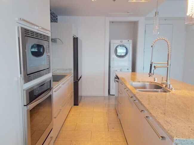 Building Photo - Experience elevated high-rise living at The Martin.