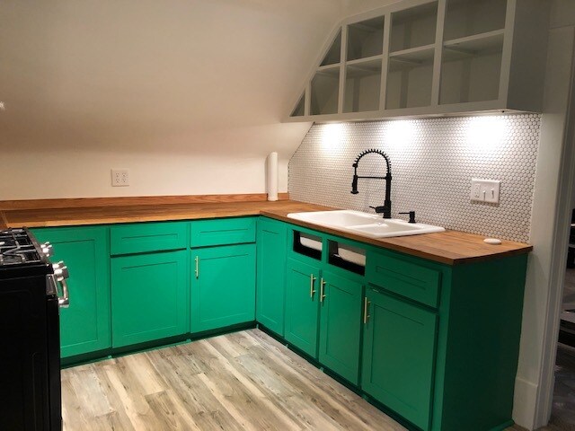 Kitchen - Cabinets in front of sink have covers not pictured. Upper cabinets, open shelving. - 662 Lamberton St NE