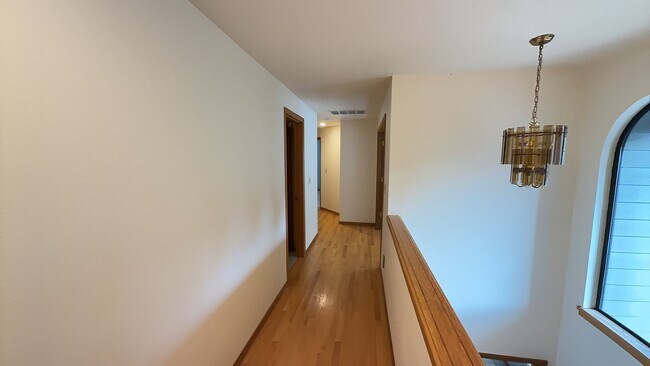 Building Photo - 4bd/3ba HUGE Home w/Hardwood Floors, Russian Fireplace, 2-Car Garage & Fenced Back Yard!