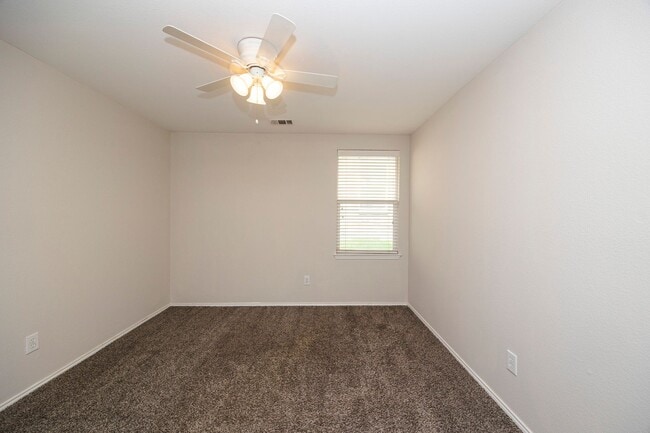 Building Photo - Great curb appeal from the mature shade tr...