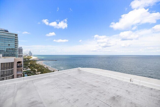 Building Photo - 10155 Collins Ave
