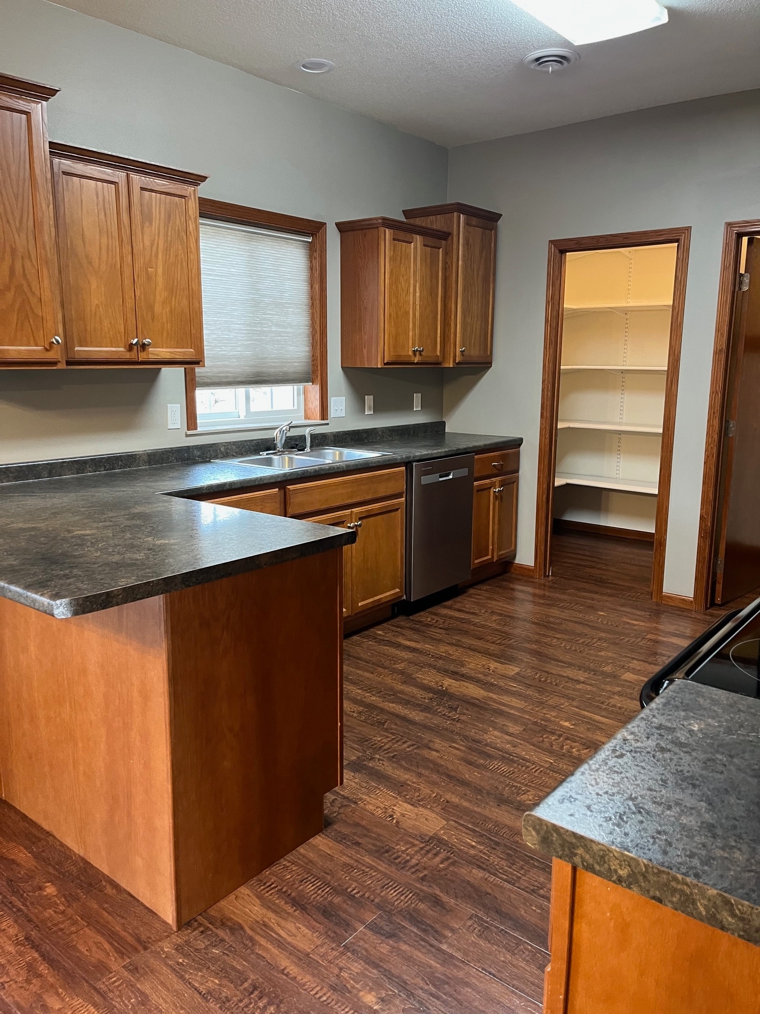 Large kitchen with ample counters, walk-in pantry and a great deal of storage. - 1501 Grove Pl