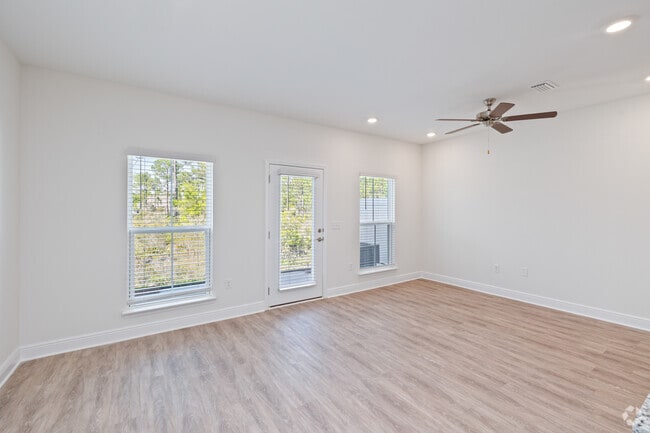 3BR, 2.5BA - 1,550SF - Living Room - Cottages at Mack Bayou